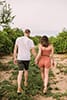 Cottagecore engagement session in an orange grove.