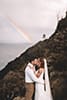 Hawaii elopement first kiss with rainbow