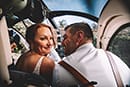 Bride and groom in helicopter