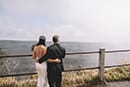 Bride and groom looking at volcano