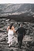 Bride and groom on dried lava beds