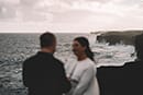 Bride and groom along cliffs