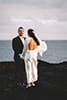 Bride and groom on sea cliffs in Hawaii